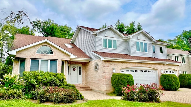 view of front of property with a garage