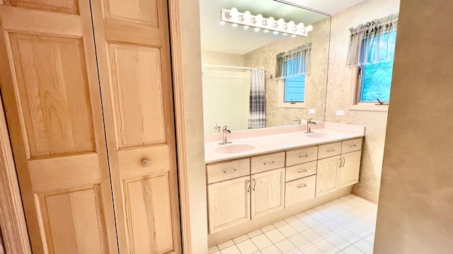 bathroom featuring vanity, tile patterned floors, and walk in shower