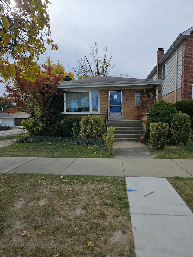 view of front of home with a front yard