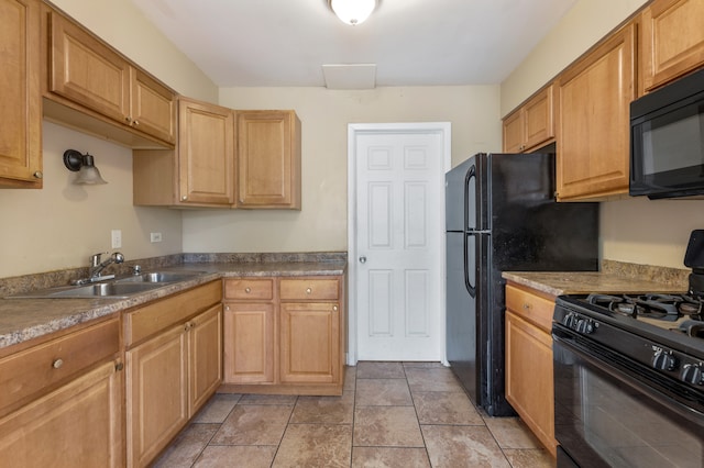 kitchen featuring black appliances and sink