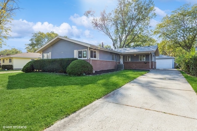 ranch-style home with central AC, a front yard, and a garage