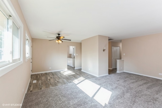 unfurnished room with hardwood / wood-style floors and ceiling fan