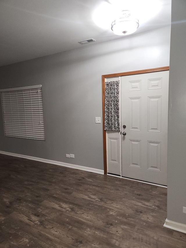 entryway with dark hardwood / wood-style floors