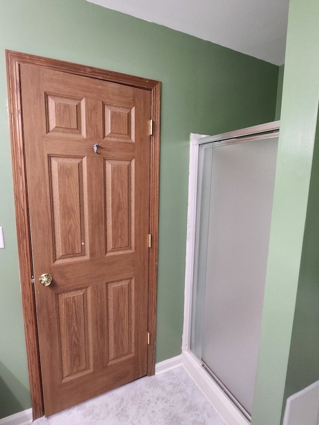 bathroom featuring an enclosed shower