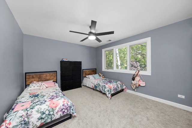 carpeted bedroom featuring ceiling fan