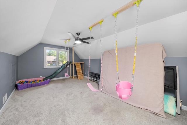 playroom with carpet floors, ceiling fan, and vaulted ceiling