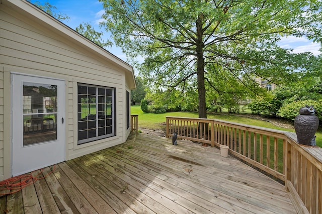 wooden terrace with a yard