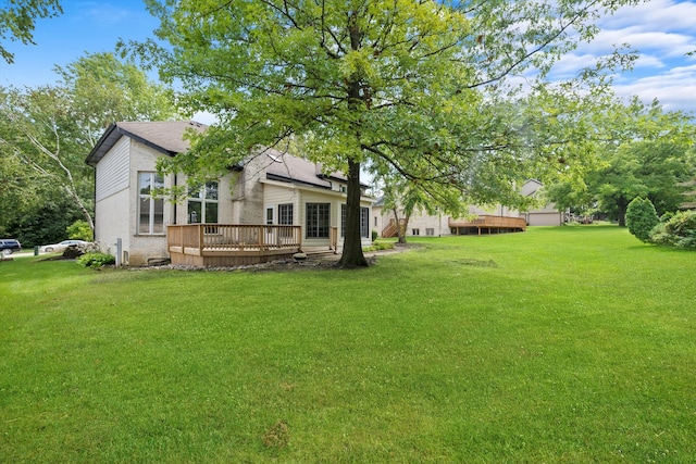 view of yard featuring a wooden deck