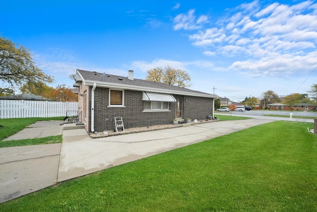 view of property exterior with a lawn