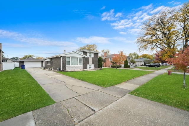 view of front of house with a front yard and a garage