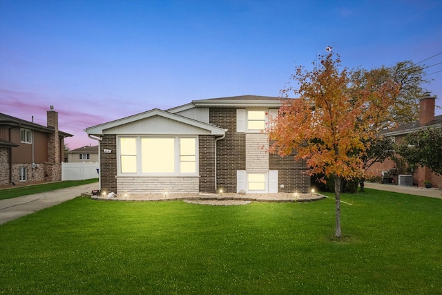 view of front of house with a lawn