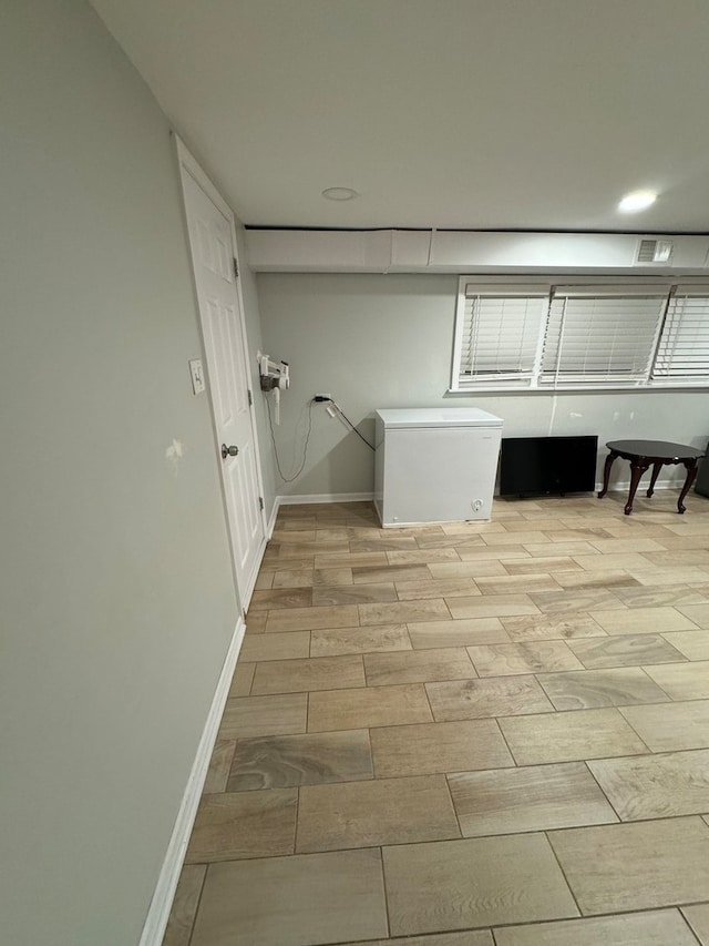 laundry area featuring light wood-type flooring