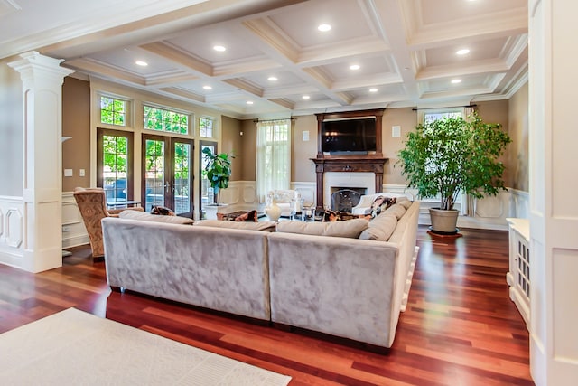 living room with beamed ceiling, ornamental molding, french doors, and dark hardwood / wood-style flooring