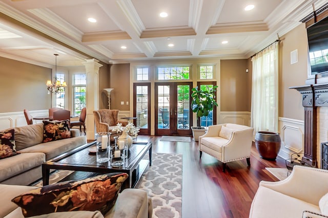 living room with ornamental molding, dark wood-type flooring, and french doors