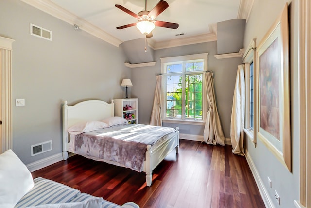 bedroom with crown molding, dark wood-type flooring, and ceiling fan