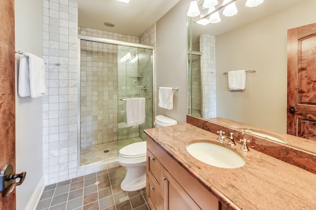 bathroom featuring vanity, toilet, tile patterned floors, and an enclosed shower