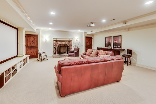 carpeted home theater featuring ornamental molding and a fireplace