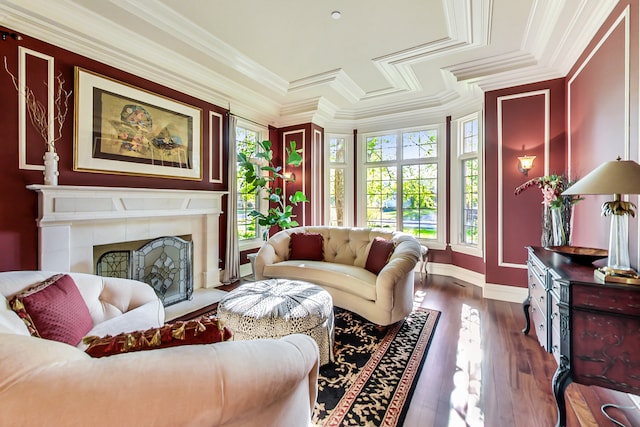 living room with dark wood-type flooring, crown molding, a wealth of natural light, and a tile fireplace