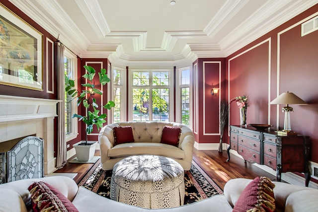 living room featuring ornamental molding, wood-type flooring, and plenty of natural light