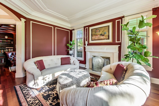 living room featuring hardwood / wood-style flooring and ornamental molding