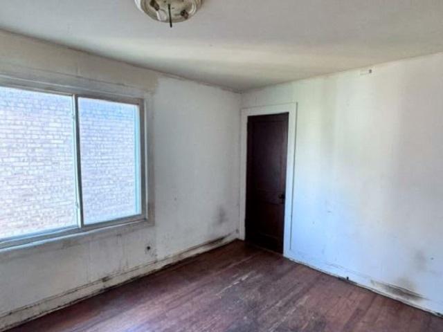 2654 W 98th Pl, Evergreen Park, IL 60805 - unfurnished room with wood finished floors and plenty of natural light