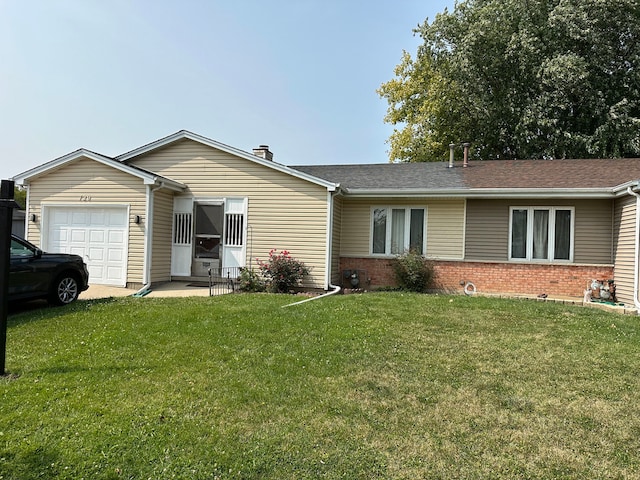 ranch-style house with a garage and a front lawn