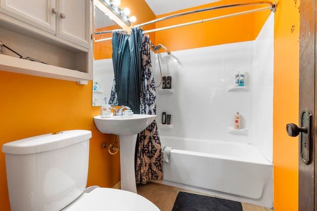 bathroom with shower / tub combo, toilet, and tile patterned flooring