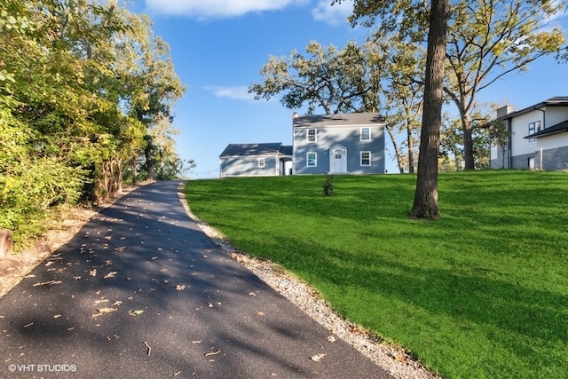 exterior space featuring a front lawn