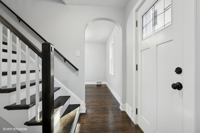 entrance foyer featuring dark hardwood / wood-style floors