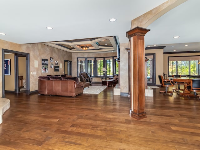 living room with beam ceiling, decorative columns, and dark wood-type flooring