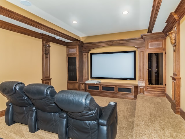 cinema featuring ornate columns, carpet, and ornamental molding