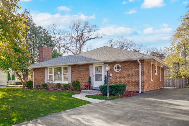 ranch-style house with a front lawn