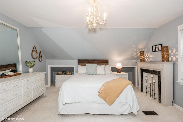 bedroom with lofted ceiling and a chandelier