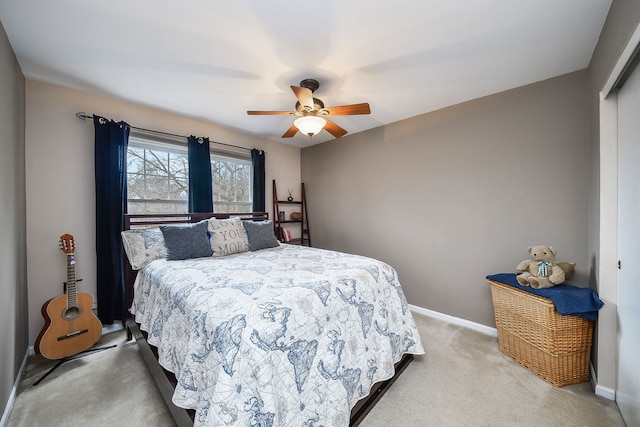 bedroom featuring ceiling fan, a closet, and carpet