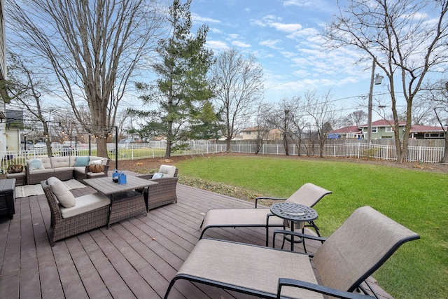 wooden terrace featuring outdoor lounge area and a lawn