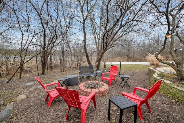 view of patio / terrace with an outdoor fire pit