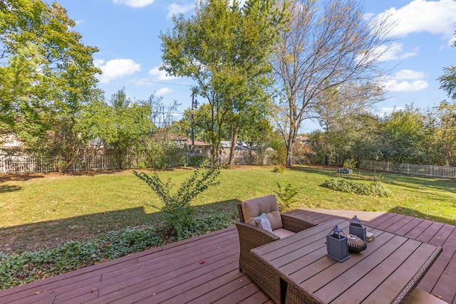 wooden terrace with a yard