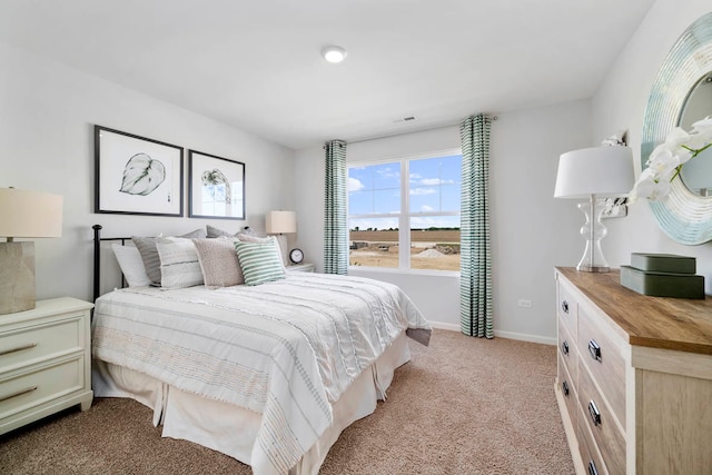 bedroom featuring light carpet