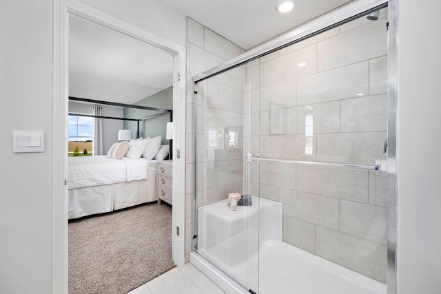 bathroom featuring a shower with shower door