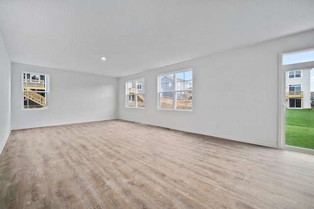 spare room featuring light hardwood / wood-style flooring