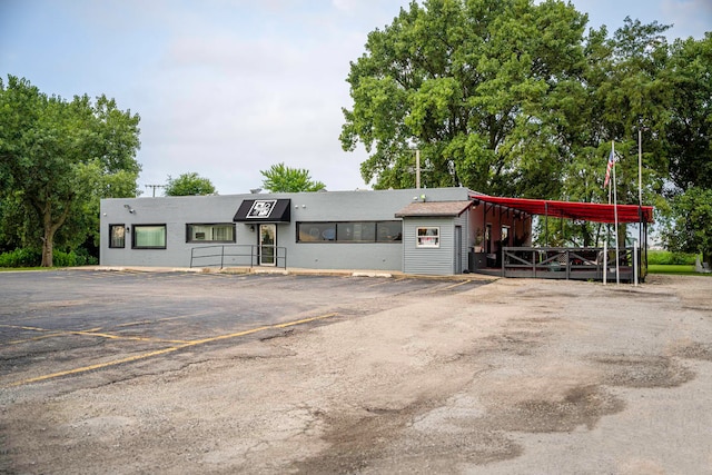 view of front of property with a carport