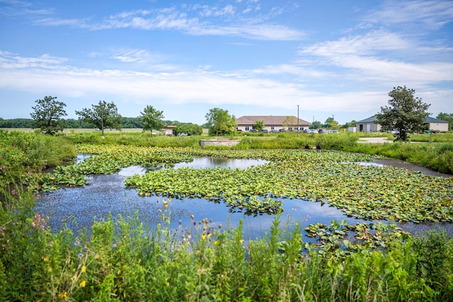 surrounding community with a water view