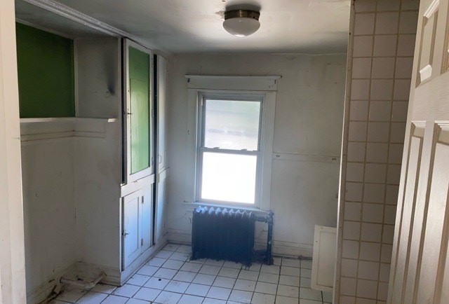 bathroom with tile patterned floors