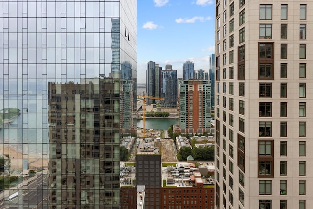 property's view of city featuring a water view