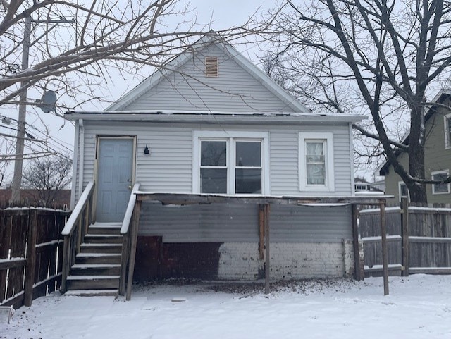 view of snow covered house