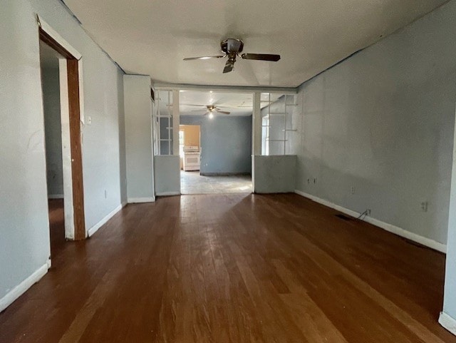 empty room with ceiling fan and wood-type flooring