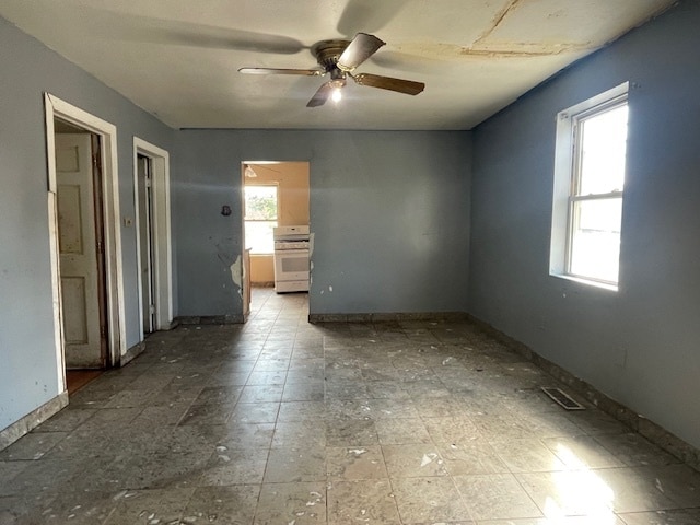 unfurnished room featuring hardwood / wood-style flooring and a wealth of natural light