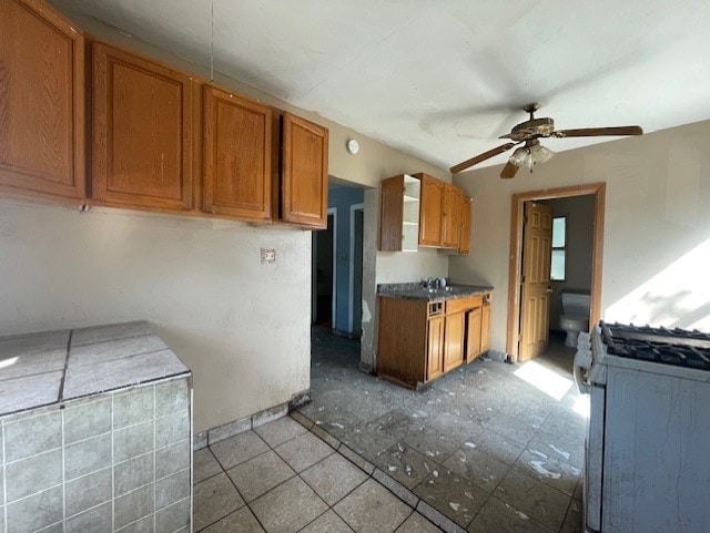 bathroom with enclosed tub / shower combo and tile patterned floors