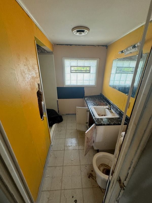 bathroom featuring vanity and toilet