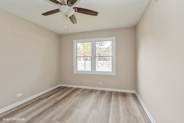 empty room featuring light hardwood / wood-style flooring and ceiling fan